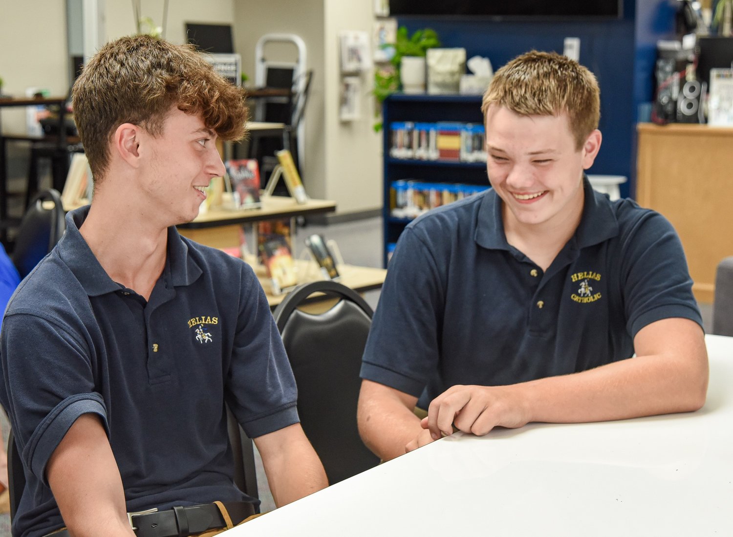 Matteo Chignoli, left, talks about spending a week at Helias Catholic High School and visiting Missouri during an interview Aug. 24 in the library at Helias Catholic. Chignoli is from Italy and attends the Whitney English Academy in Spain but was in Missouri for about two weeks to sample American culture.